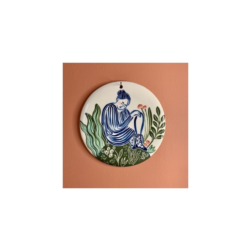 Tableau femme assise aux fleurs